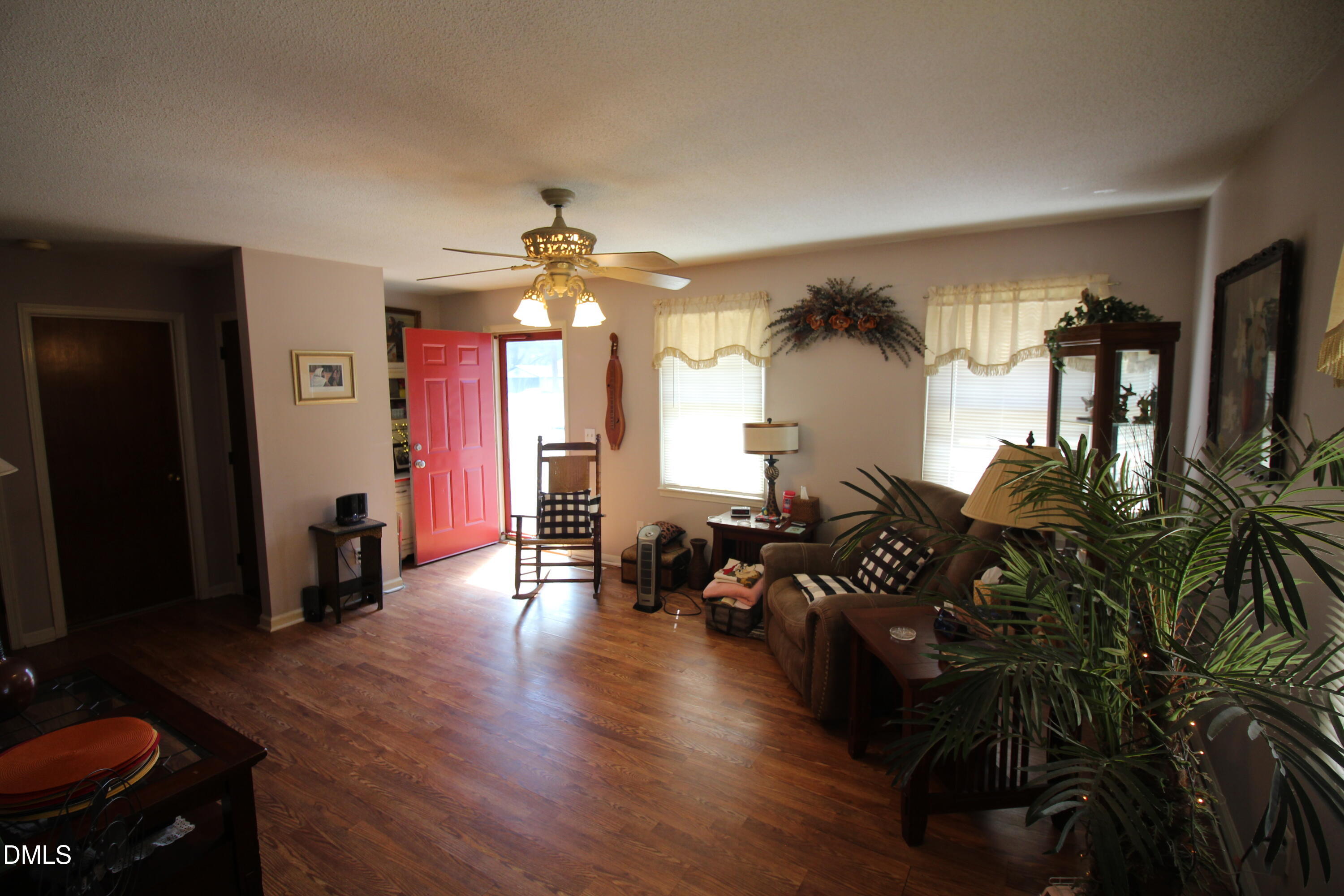 56 Ash Street Coats, NC 27521 - Photo 16 of 28 a living room with furniture and wooden floor