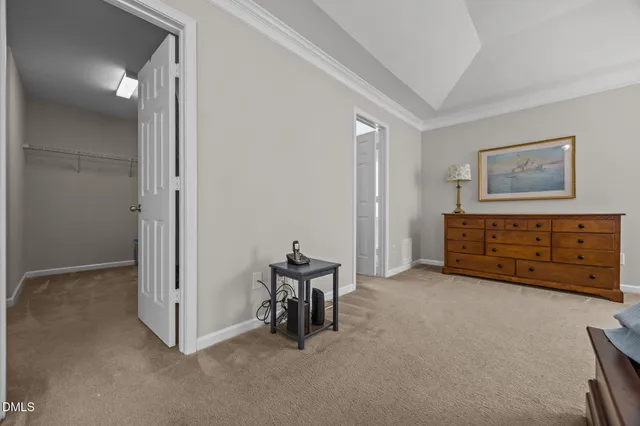 an empty room with furniture and a window