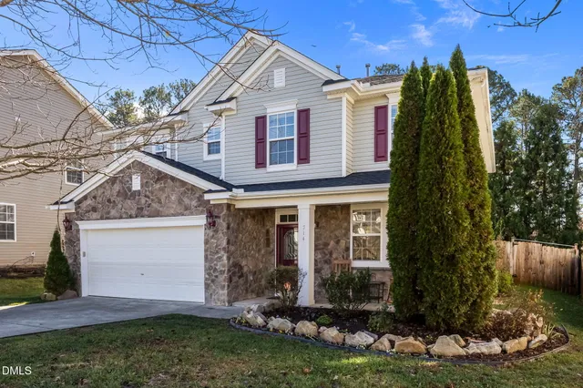a view of a house with a yard and plants