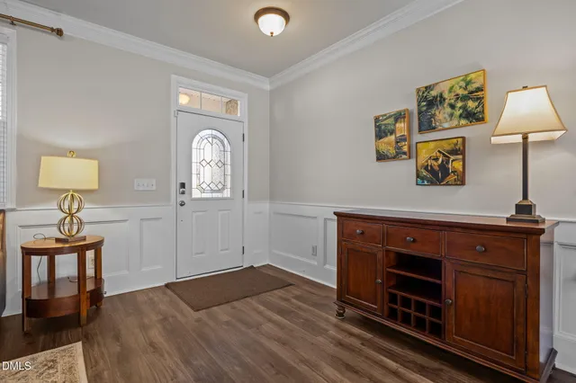 a view of a workspace with furniture and wooden floor