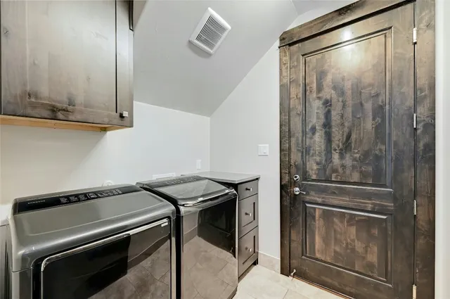 a bathroom with a sink vanity mirror and toilet