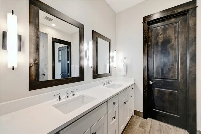 a bedroom with a bed a desk and chair