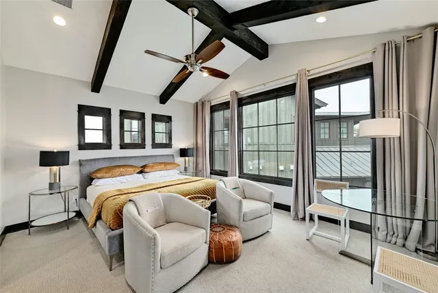 a bedroom with furniture and window