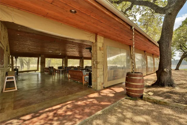 a bedroom with two beds and a chandelier