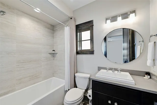 a view of a patio with a table and chairs