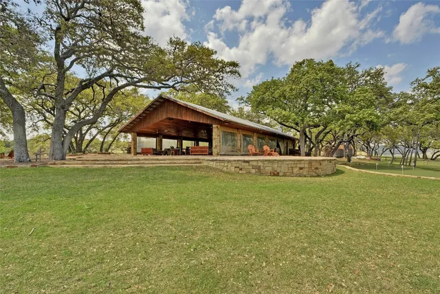 a view of swimming pool with a lounge chairs