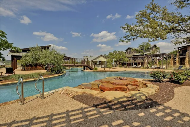 a view of swimming pool with seating space