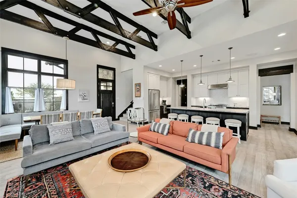 a living room with furniture and a rug