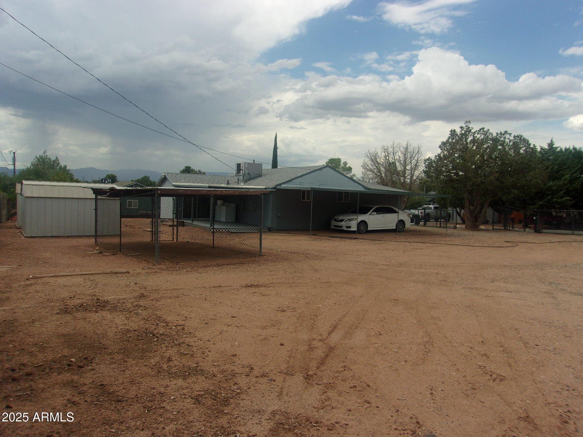 4765 East Valley Lane Rimrock, AZ 86335 - Photo 1 of 25 a view of a car park in front of house