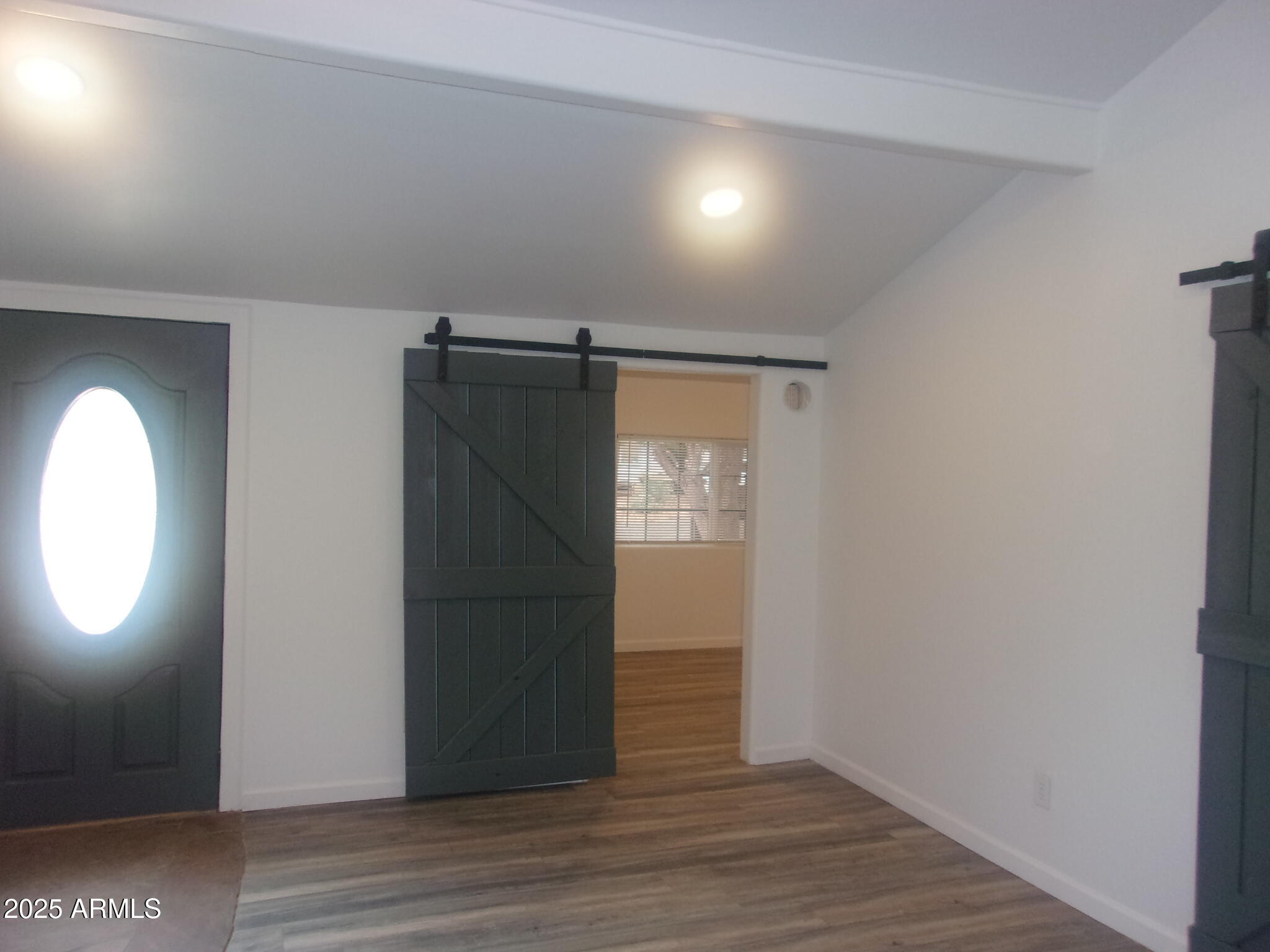 4765 East Valley Lane Rimrock, AZ 86335 - Photo 13 of 25 an empty room with wooden floor cabinet and closet