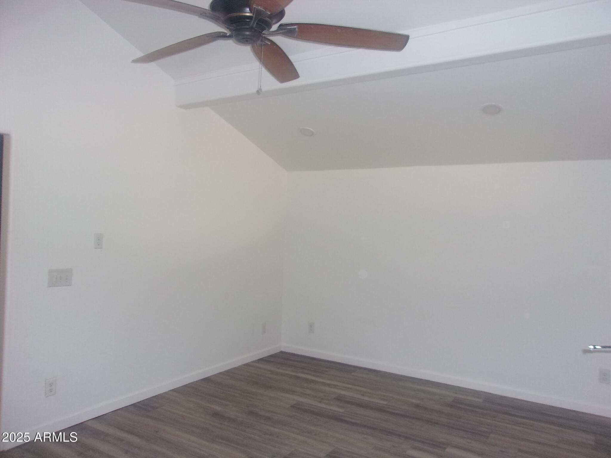 4765 East Valley Lane Rimrock, AZ 86335 - Photo 8 of 25 a view of a small space with wooden floor and a ceiling fan