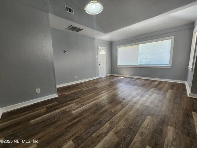 a kitchen with stainless steel appliances granite countertop a refrigerator sink and cabinets