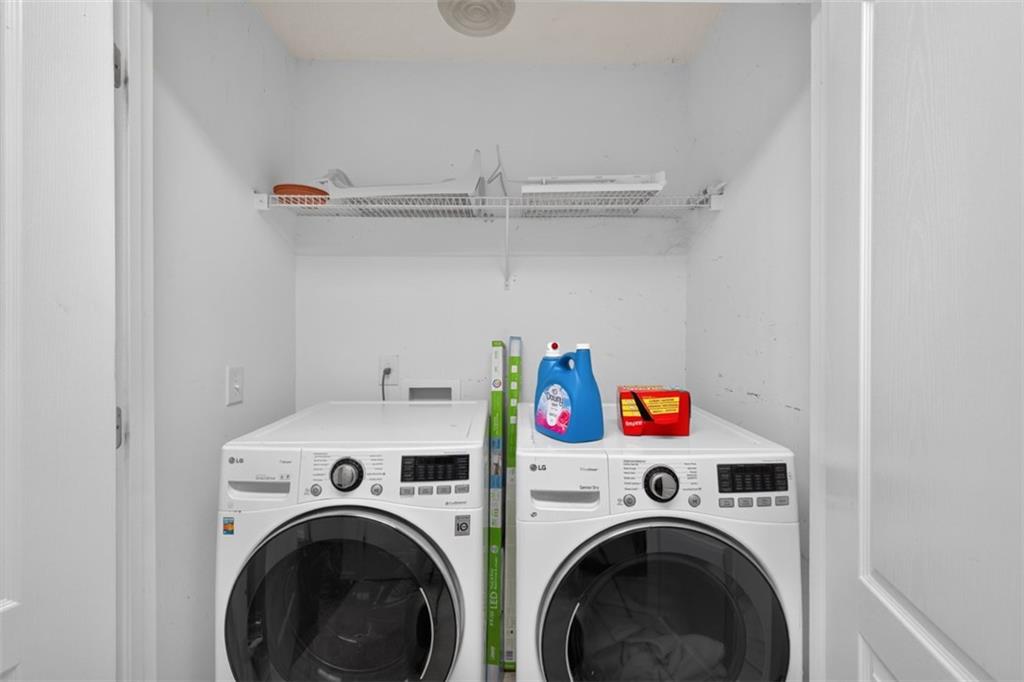 602 Pendergrass Road Winder, GA 30680 - Photo 36 of 44 a utility room with dryer washer and empty racks