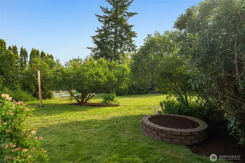 a view of a swimming pool with a yard