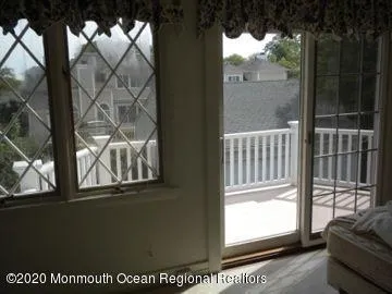 a view of balcony with furniture