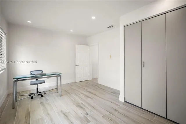 a view of room with a table and chairs