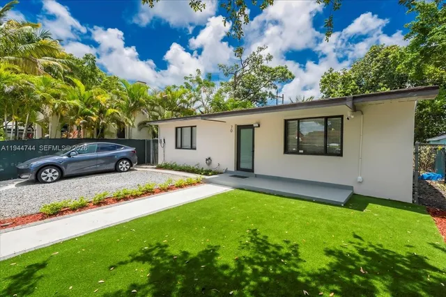 a view of a backyard with a garden and plants