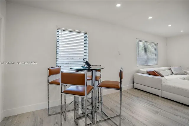 a living room with furniture and a window