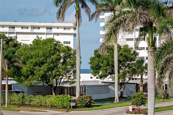 a front view of a house with tree s
