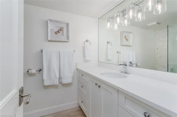 a bathroom with a double vanity sink mirror and double
