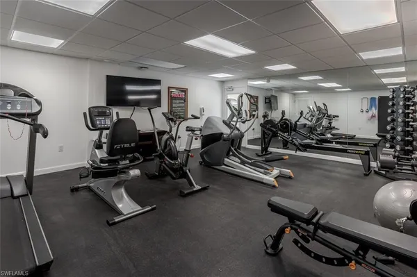 a view of a swimming pool with outdoor seating
