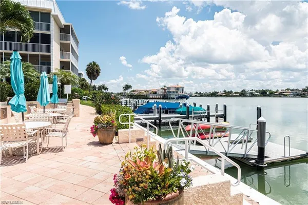a view of a lake with sitting area