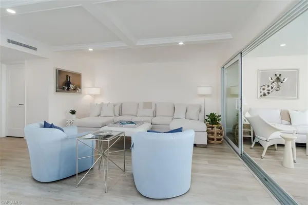 a living room with fireplace furniture and a flat screen tv