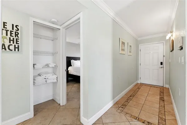 a view of a hallway with closet and wooden floor