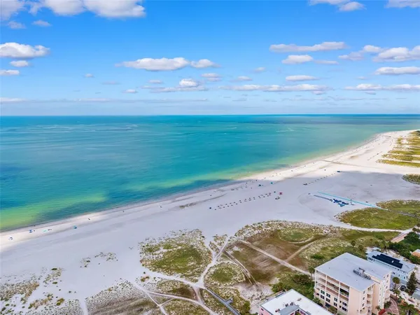 a aerial view of multiple house with a yard
