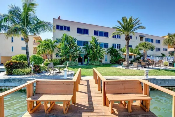 a swimming pool with outdoor seating and yard