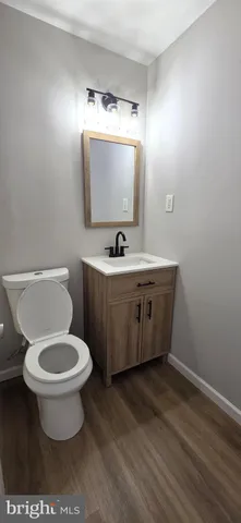 a bathroom with a toilet and bathtub