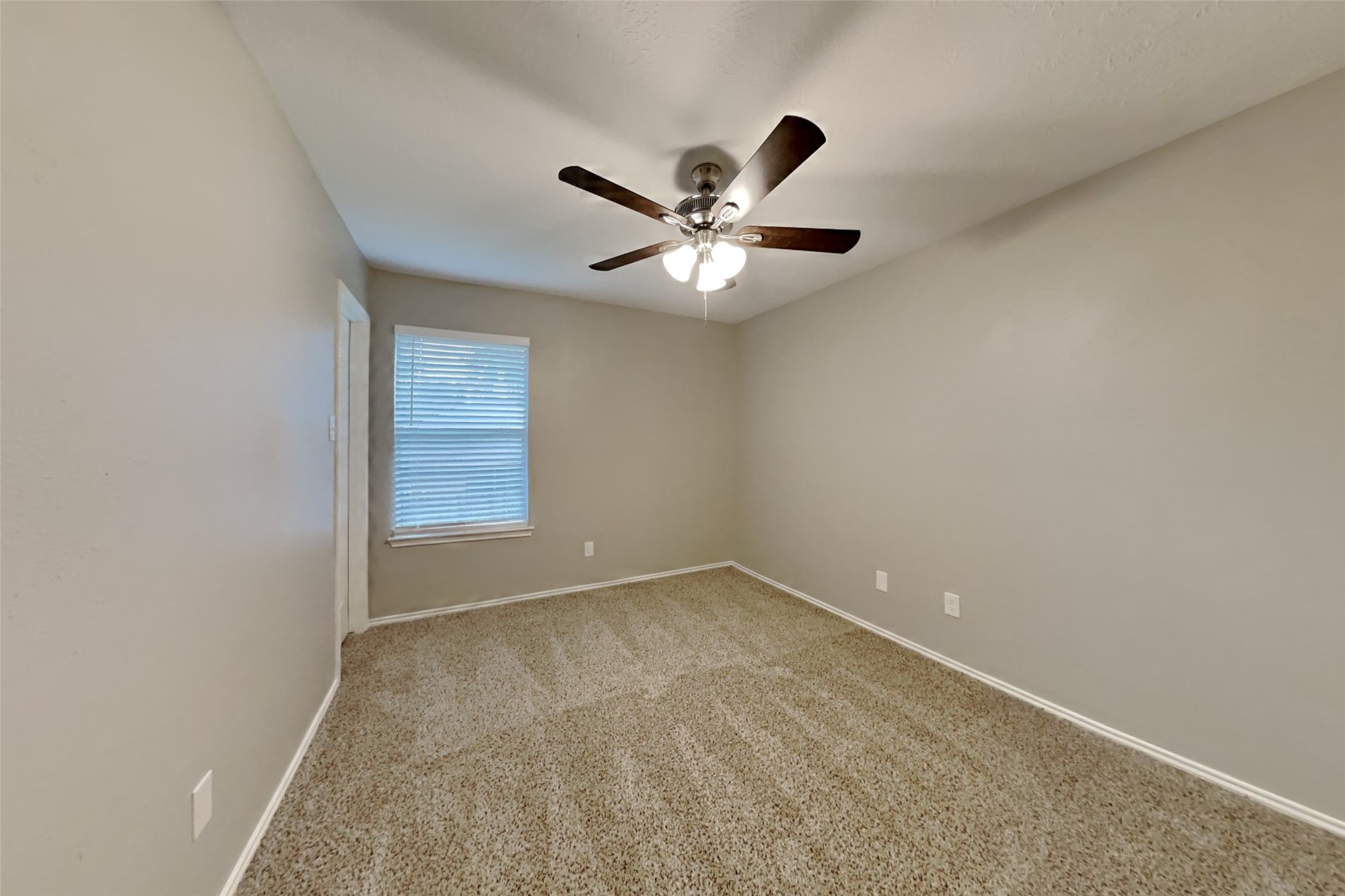 20314 Savannah Bay Road Cypress, TX 77433 - Photo 12 of 21 an empty room with a window and a fan