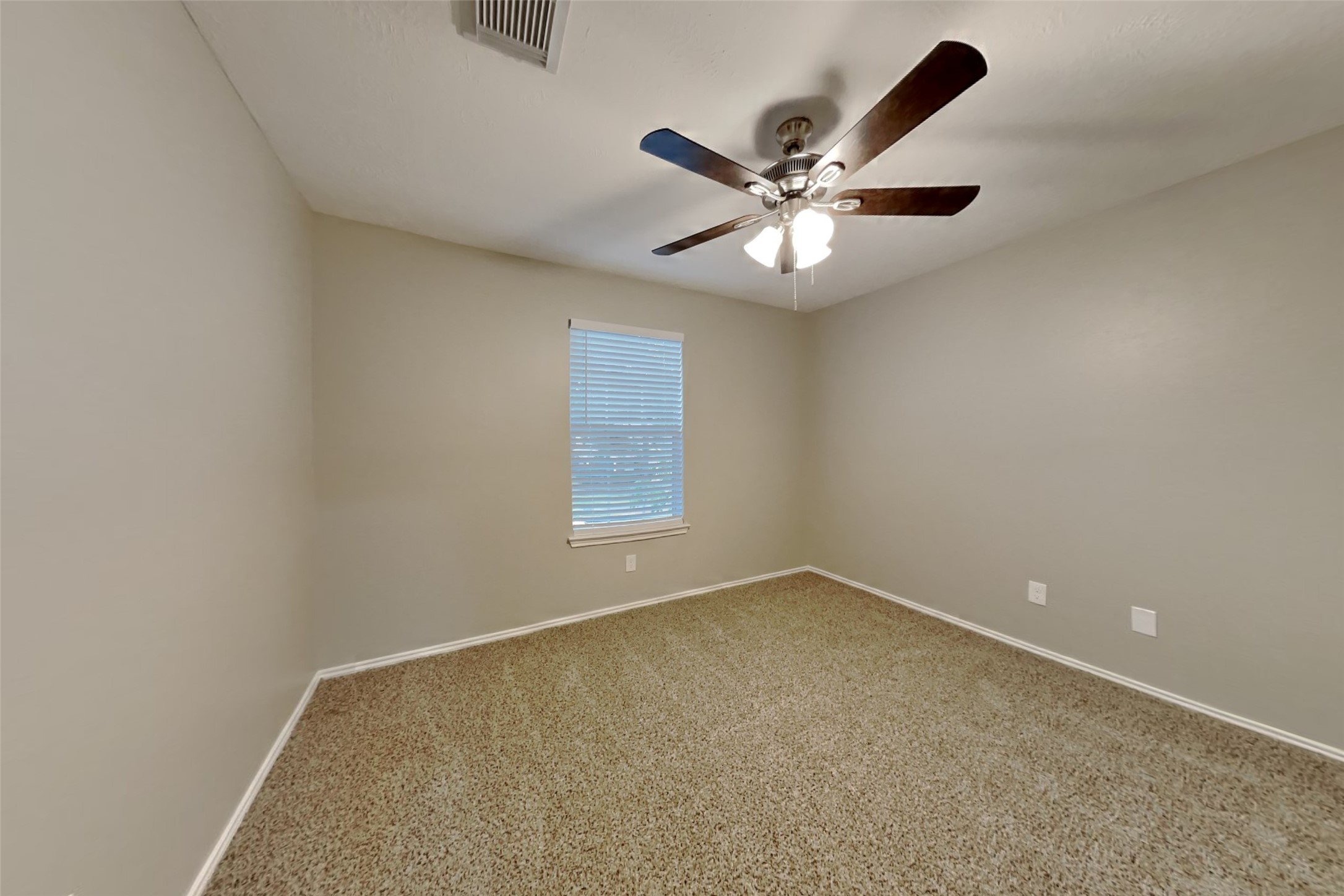 20314 Savannah Bay Road Cypress, TX 77433 - Photo 13 of 21 an empty room with a window and a fan