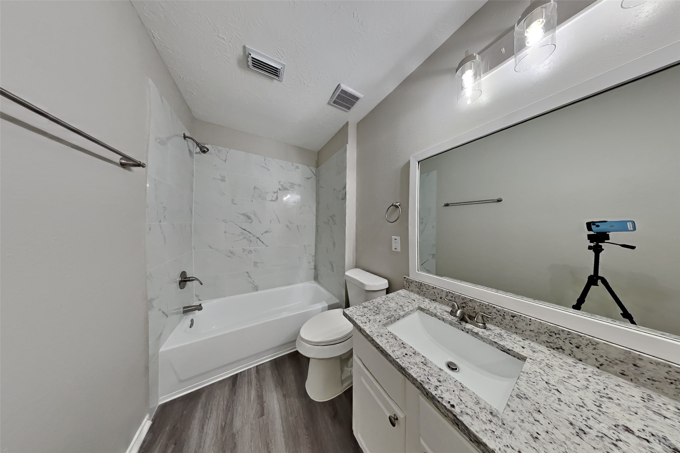 20314 Savannah Bay Road Cypress, TX 77433 - Photo 17 of 21 a bathroom with a granite countertop sink toilet and shower