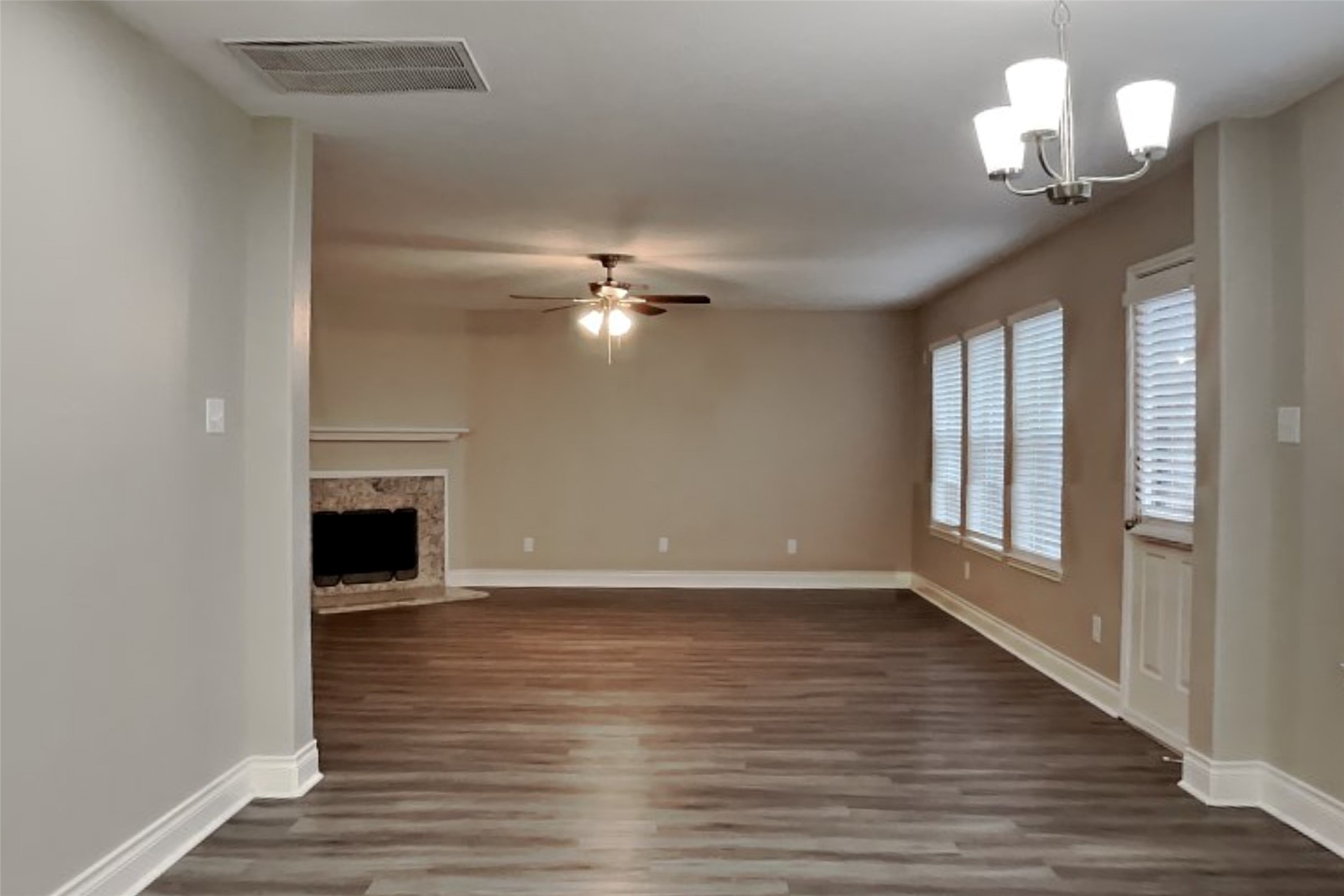 20314 Savannah Bay Road Cypress, TX 77433 - Photo 2 of 21 a view of an empty room with wooden floor and a window