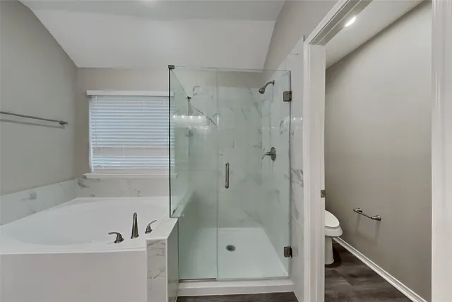 a bathroom with a bathtub and a shower