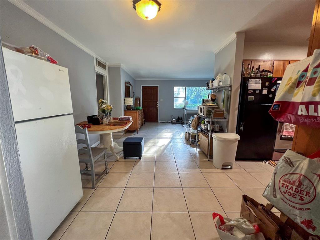 630 Northwest 36th Street Gainesville, FL 32607 - Photo 17 of 22 a kitchen with a refrigerator and a stove