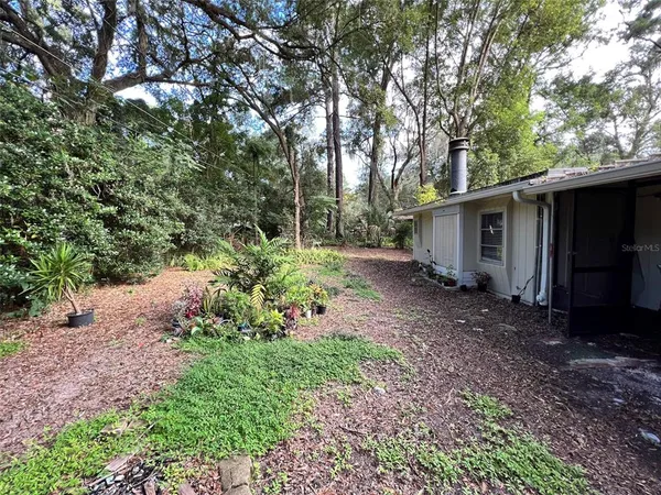 a backyard of a house with lots of green space