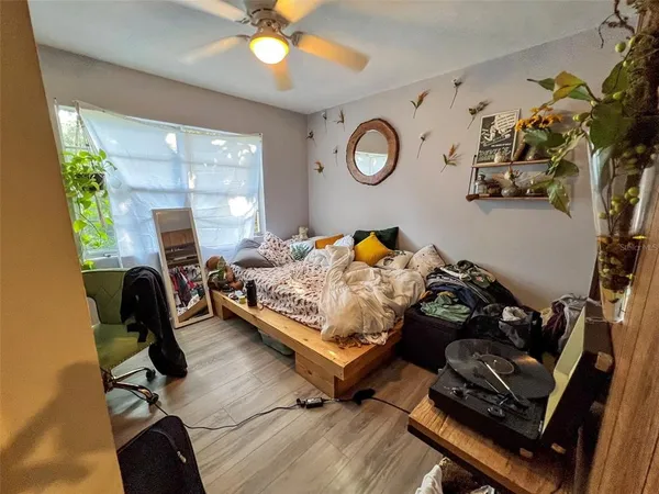 a bedroom with furniture and a window