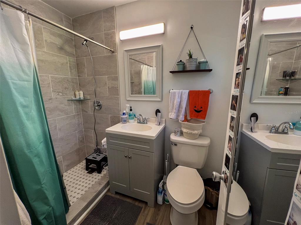 630 Northwest 36th Street Gainesville, FL 32607 - Photo 10 of 22 a bathroom with a sink toilet and shower