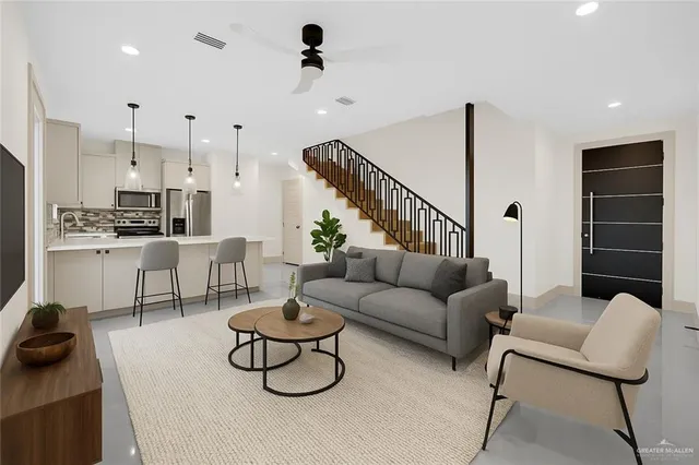 a living room with furniture and a rug