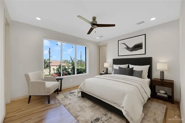 a bedroom with a bed and a table