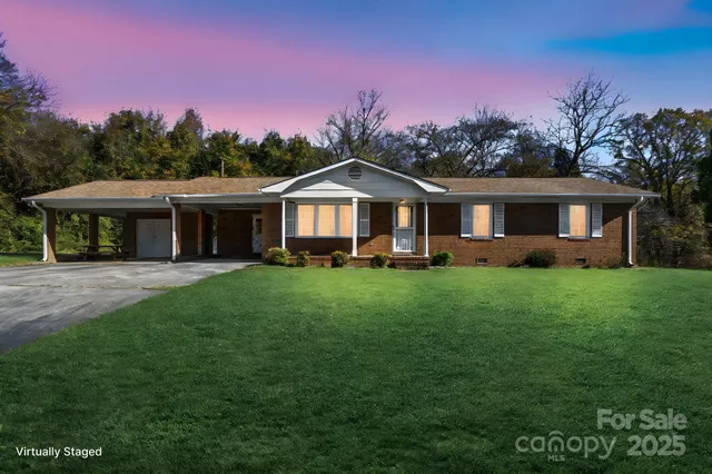 a front view of a house with a yard table and chairs