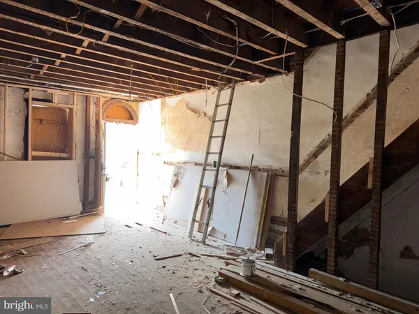 a view of a door and wooden floor