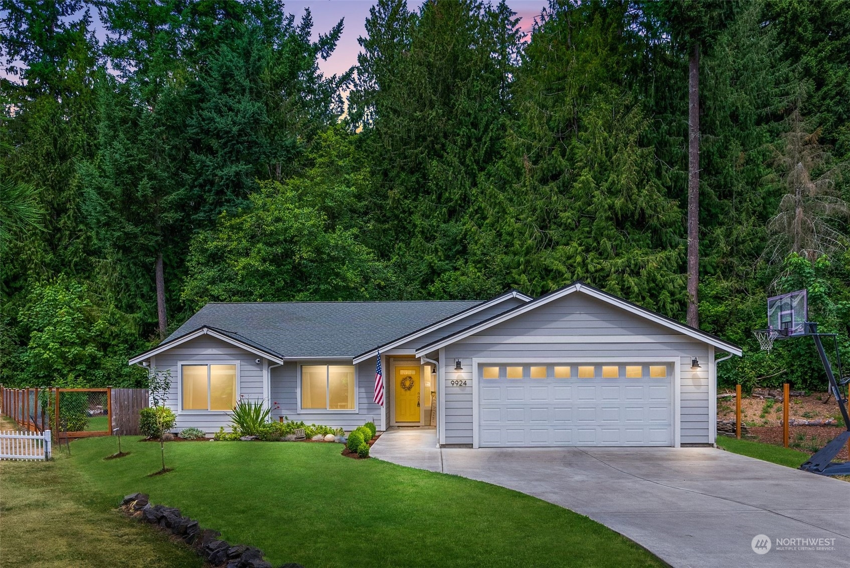 9924 Angeline Road East Bonney Lake, WA 98391 - Photo 1 of 31 a front view of a house with a yard and garage