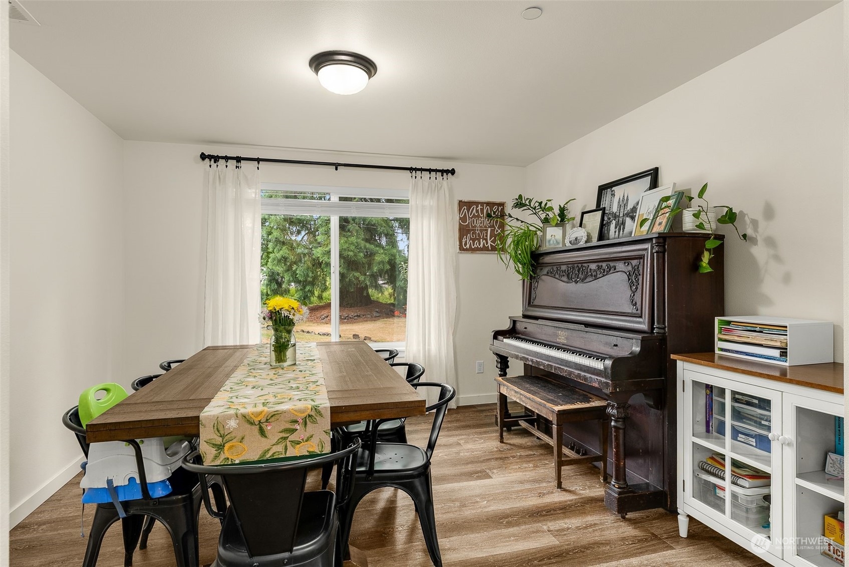 9924 Angeline Road East Bonney Lake, WA 98391 - Photo 14 of 31 a view of a dining room with furniture window and outside view