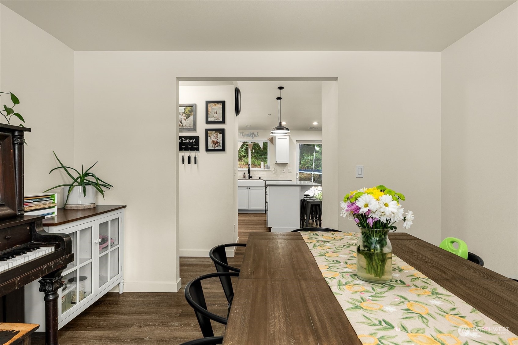 9924 Angeline Road East Bonney Lake, WA 98391 - Photo 15 of 31 a dining room with furniture and wooden floor
