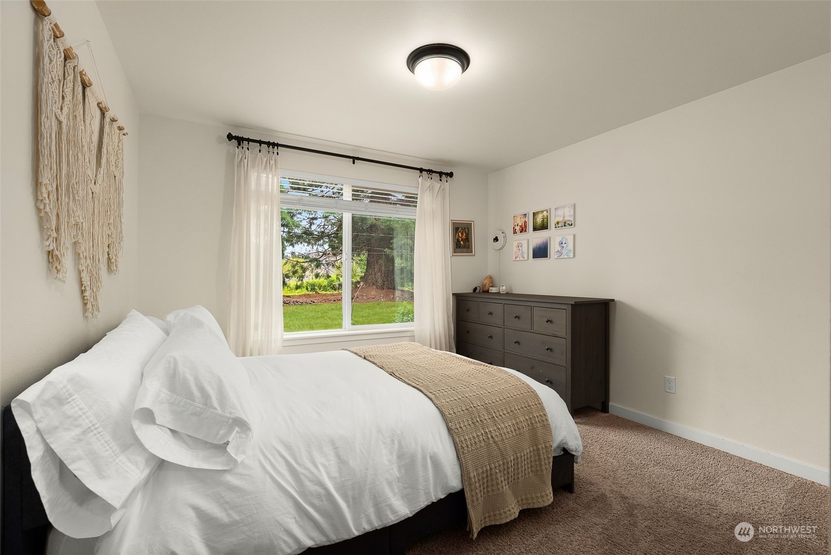 9924 Angeline Road East Bonney Lake, WA 98391 - Photo 16 of 31 a bedroom with a bed and a window