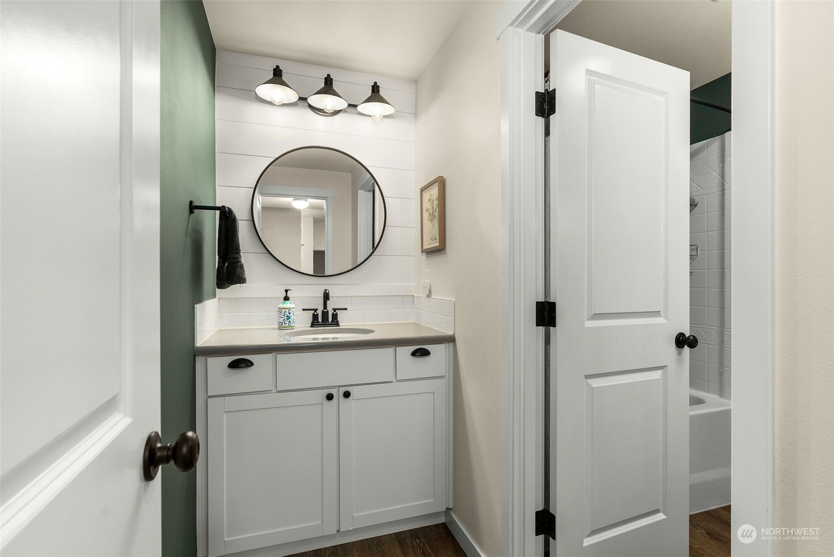 9924 Angeline Road East Bonney Lake, WA 98391 - Photo 17 of 31 a bathroom with a sink and a mirror