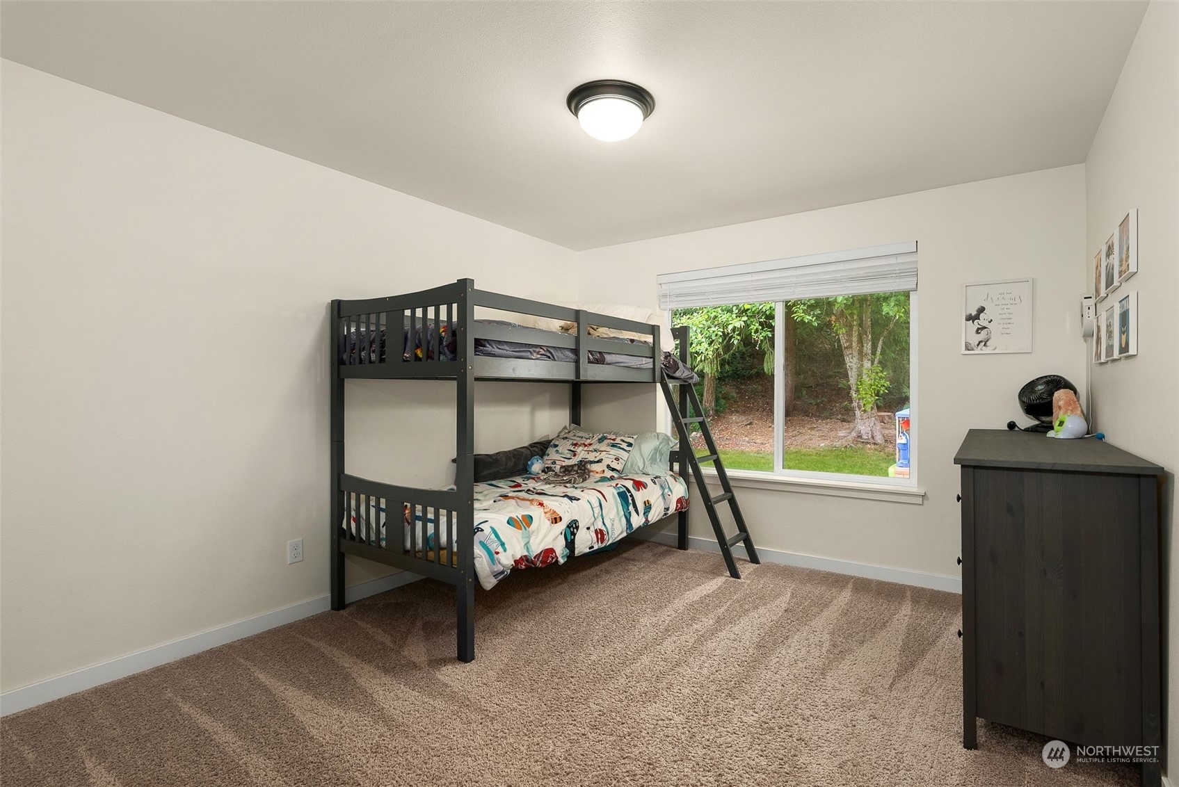 9924 Angeline Road East Bonney Lake, WA 98391 - Photo 19 of 31 a bedroom with furniture and a window